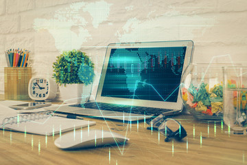 Multi exposure of chart and financial info and work space with computer background. Concept of...