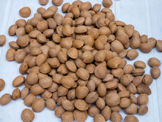  Organic texture of almond nuts in shell top view, Almonds macro. Almonds background.