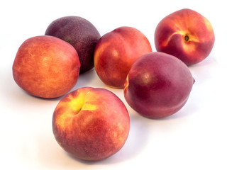 Group of nectarines on a white background.