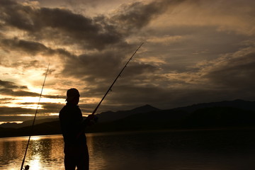 fishing at sunset