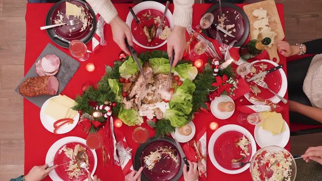 Timelapse Top view of family celebrating christmas with a feast and traditional food.
