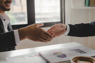Partnership. two business people shaking hand after brainstorming about business plan in meeting room at office, congratulation, investor, success, interview, partnership, teamwork, financial concept