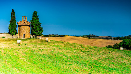 Fototapeta na wymiar Landscape with Chapel Vitaleta in Tuscany, Italy, Summer