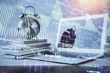 Financial graph colorful drawing and table with computer on background. Double exposure. Concept of international markets.
