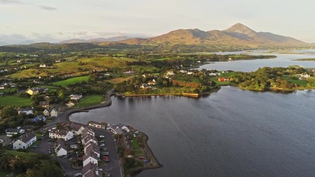 4k Aeroview of Westport harbour with Croagh Patrick mountain in background, Ireland
