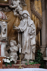 Obraz premium Saint Clare of Assisi, statue on the High Altar in the Catholic Church of the Saint Clare in Kotor, Montenegro