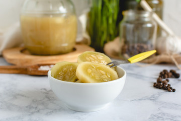 Marinated cucumber in a bowl on the kitchen table