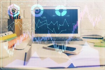 Financial market graph hologram and personal computer on background. Multi exposure. Concept of forex.