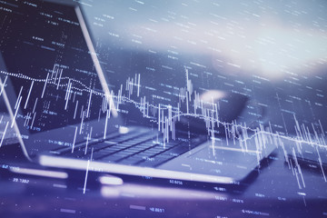 Financial market graph hologram and personal computer on background. Multi exposure. Concept of forex.