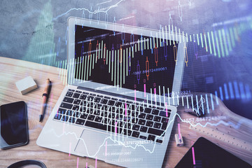 Multi exposure of graph and financial info and work space with computer background. Concept of...
