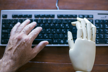 Real and prosthetic hand typing on a computer keyboard