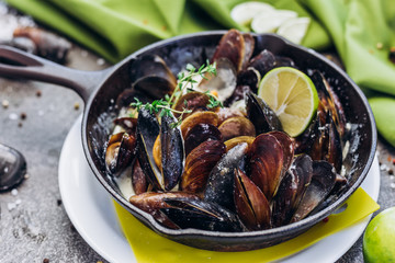 Baked Mediterranean mussels with creamy lime sauce.