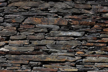 Detail of a wall of slate stones