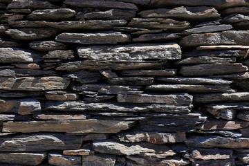 Detail of a wall of slate stones