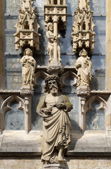 Fototapeta na wymiar Man of Sorrows with triad, statues on the facade of St James Church in Rothenburg ob der Tauber, Germany