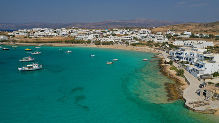 Fototapeta premium Aerial drone photo of famous sandy turquoise beach of Ammos and main port of Koufonisi island, Small Cyclades, Greece
