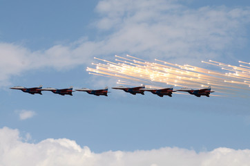 Airplanes of the Swifts military aerobatic team at a city day performance in Chelyabinsk, Russia.
