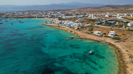 Aerial drone photo of famous sandy turquoise beach of Ammos and main port of Koufonisi island, Small Cyclades, Greece