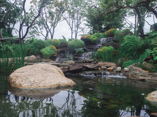 view of beautiful waterfall in green garden background - 289885362