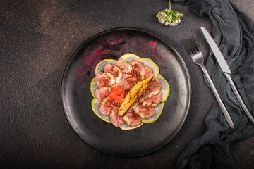 carpaccio meat duck and pear (savory snack, gourmet cuisine) menu concept. food background. copy space. Top view