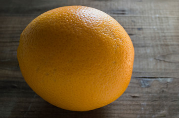 closeup of orange on wooden background