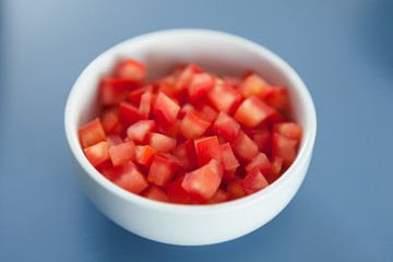 Chopped Tomato in white bowl