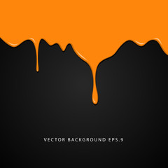 Wet orange paint on black background