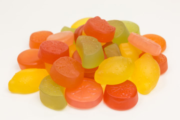 heap of gummy candy of lemon, lime, orange and grapefruit