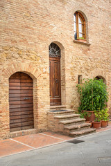 Fototapeta na wymiar Pienza, Val D'Orcia, Tuscany, Italy: tipycal home facade