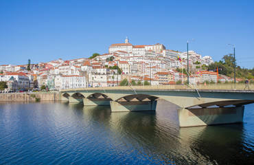 Fototapeta na wymiar Santa Clara Bridge with the old town on the hill in the background. Coimbra, Portugal