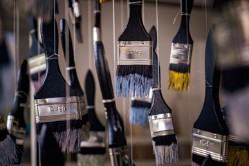 Paint brushed hung upside down for decoration