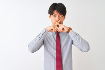 Chinese businessman wearing elegant tie standing over isolated white background Rejection expression crossing fingers doing negative sign