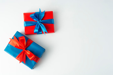 Christmas, party or birthday concept. Blue and red gift boxes isolated over white background. Copy space.