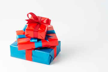 Blue and red gift boxes isolated over white background. Christmas, party or birthday concept. Copy space.