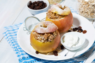healthy breakfast. oatmeal with raisins baked in apple, top view