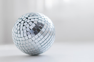 disco ball on a light background with a shadow