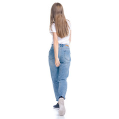 Woman in jeans casual clothing walking goes looking on white background isolation, back view