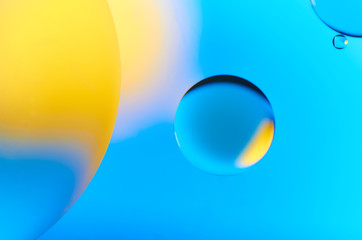 Colorful abstract images of oil drops on water. Colored circles and waves as a concept of scientific discovery, space or molecular research.