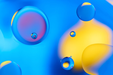 Colorful abstract images of oil drops on water. Colored circles and waves as a concept of scientific discovery, space or molecular research.