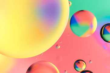 Colorful abstract images of oil drops on water. Colored circles and waves as a concept of scientific discovery, space or molecular research.