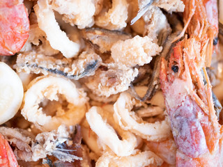 Typical Italian dish, mixed fried fresh fish with squid rings, sardines and shrimp