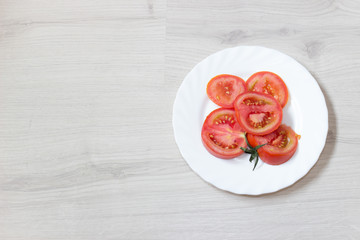 tomatoes ready to eat on a white plate