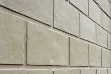 Close-up view of a gray brick wall (background)