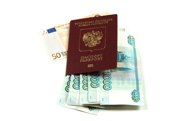 Fototapeta premium Russian foreign passport with banknotes in denominations of one thousand rubles and fifty euros. The concept of travel and tourism.