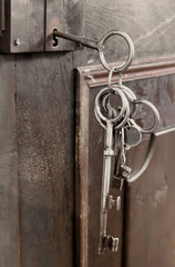 Medieval antique keys in a old door lock