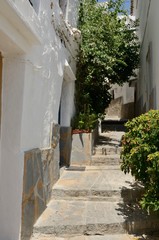 Stone stairs in narrow alley in Casares, Andalusia, Spain