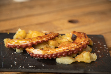 Octopus with paprika, potatoes and olive oil is a typical tapa from Galicia, Spain