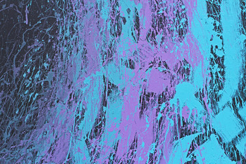 Painted wall with violet and blue splashes as background or texture