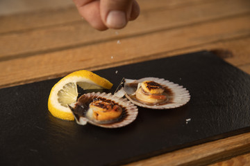 scallops with lemon, typical tapa in galicia spain