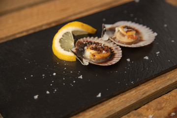 scallops with lemon, typical tapa in galicia spain